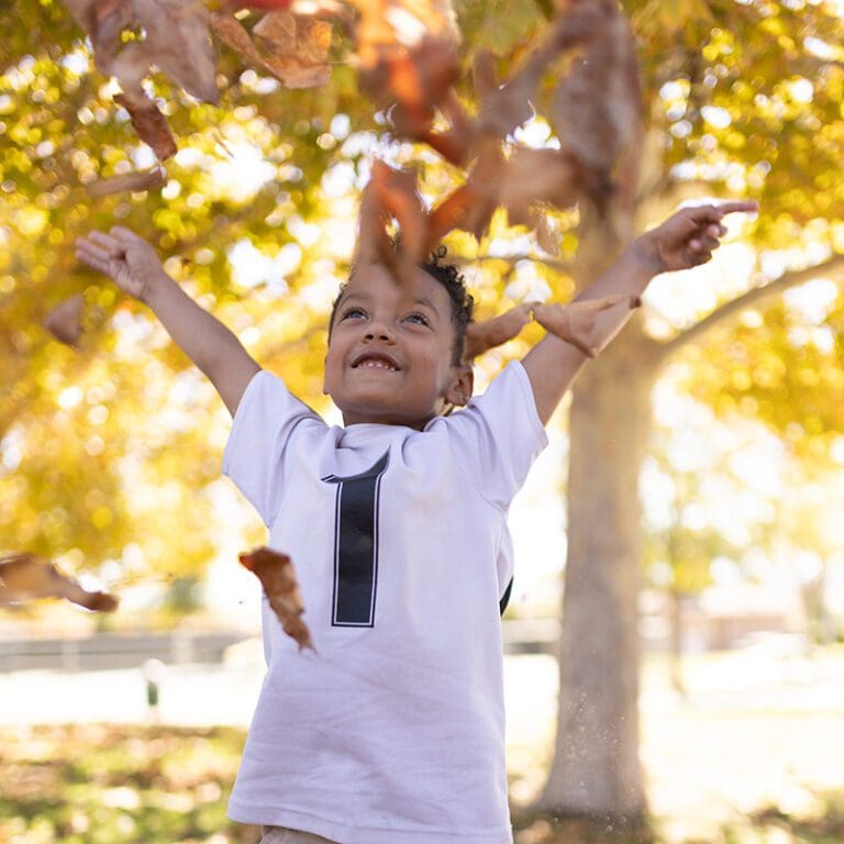 boy fall leaves